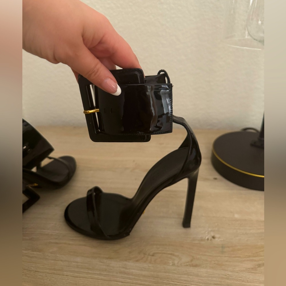Gucci high patent leather high heel sandals.